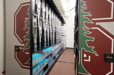 Crutches stored on pegs inside mobile storage system at Stanford University
