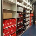 Athletic equipment storage - football team - New England Patriots equipment room - shoe storage