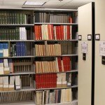 Compact mobile shelves and metal shelving in a library