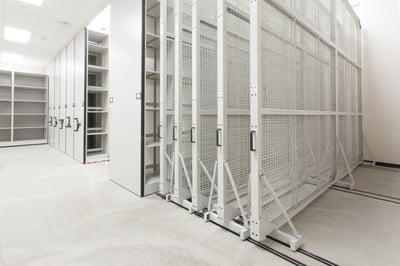 Three-dimensional objects from the university archives are stored on Spacesaver compact shelving