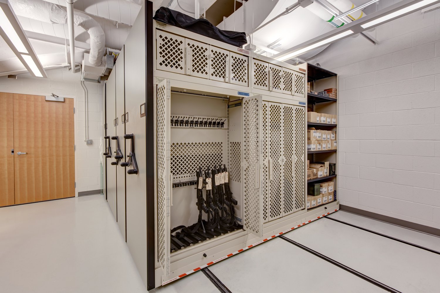 Secure Weapon Storage on Weapon Racks on Compact Shelving