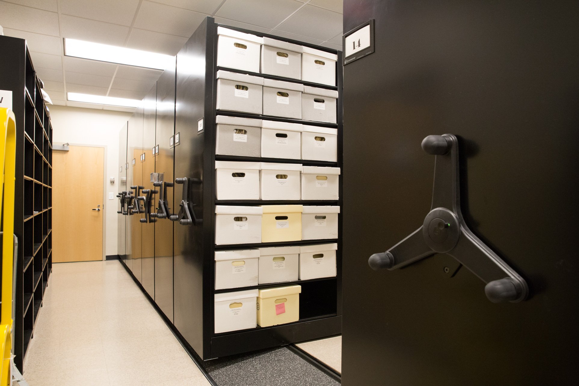 Compact file storage on mechanical assist