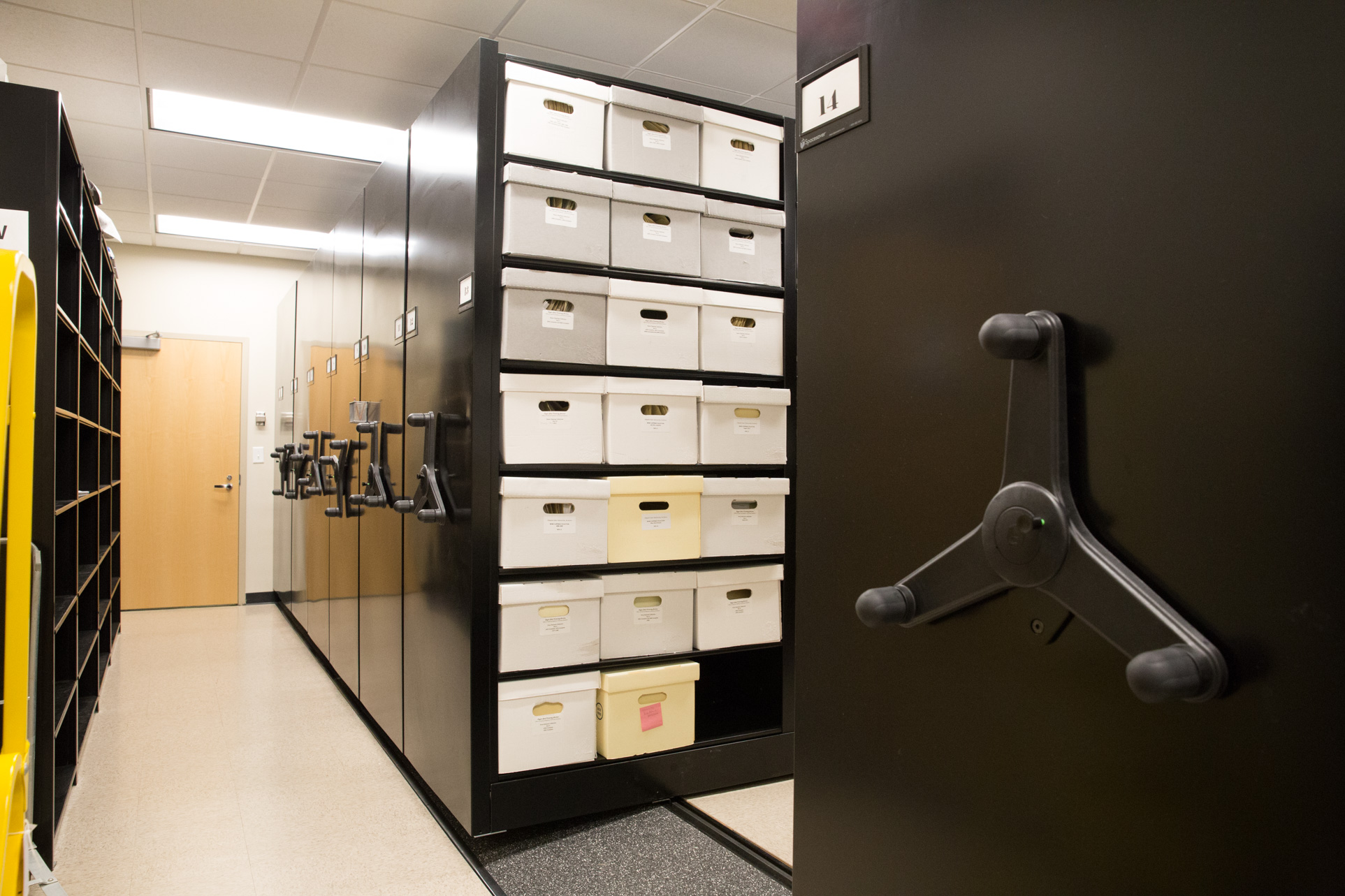 Compact file storage on mechanical assist