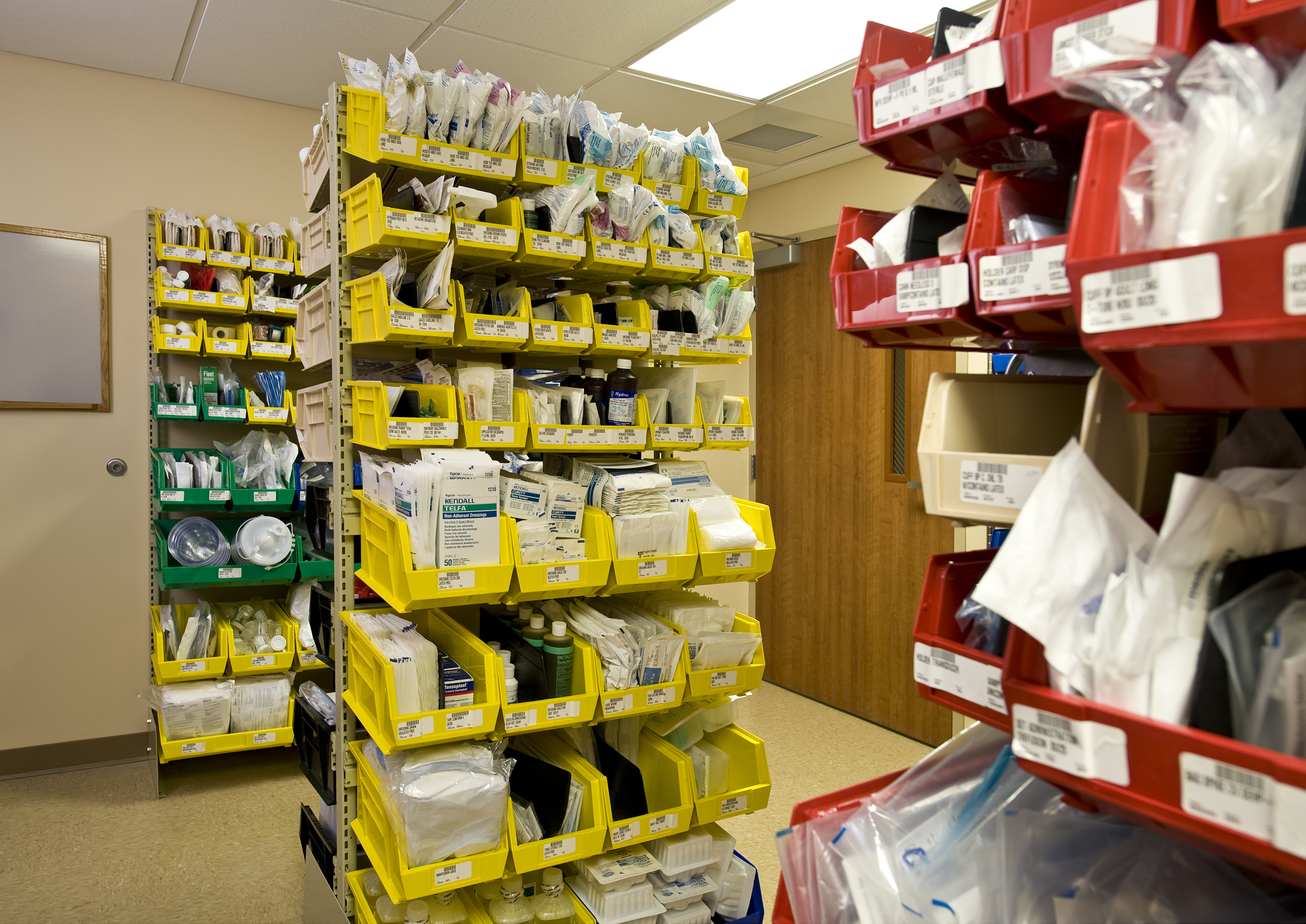 Plastic bin storage on cantilever shelving