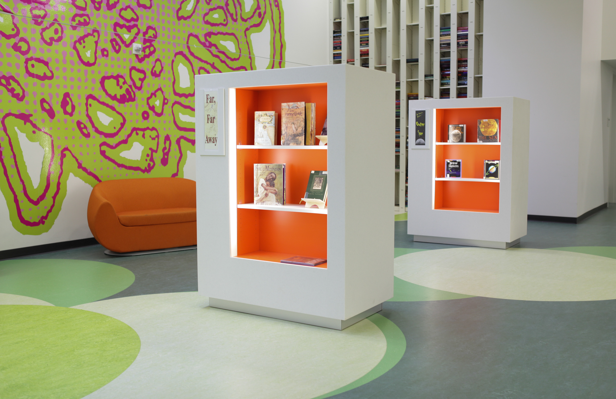 Fun colorful and bright Library shelving on case type shelving